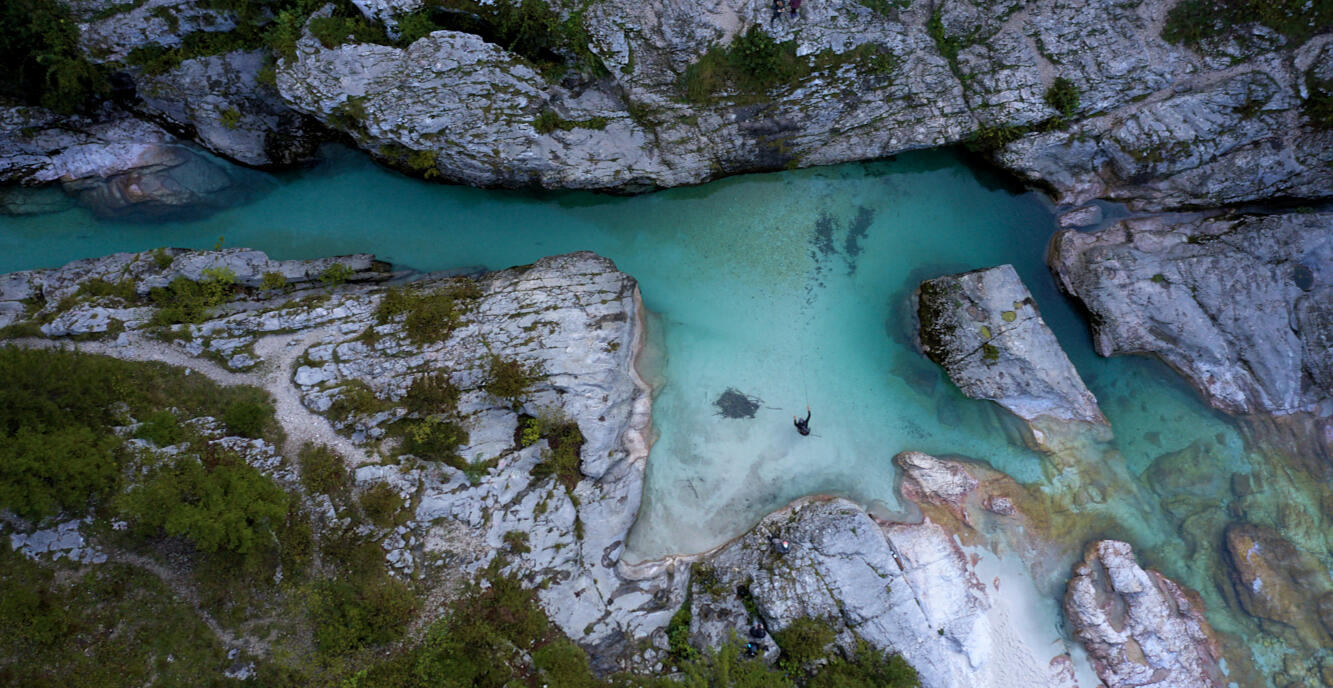 Fly fishing on the turquoise Soča River in Slovenia.
